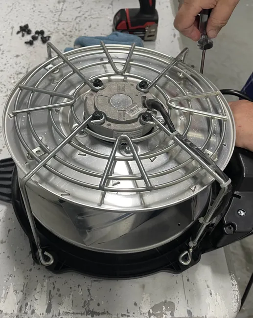 technician working on fan